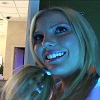 Photo of Christine in Money Talks video: Tanning Bed